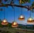 4-Pack KOOPER Outdoor Hanging Candle Solar Lanterns for $15