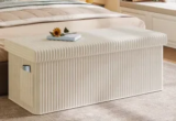 Pinmoco 43″ Folding Storage Ottoman Bench with Side Pocket for $40